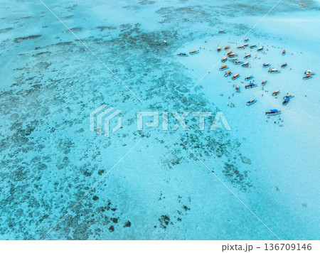 Aerial view of boats and yachts in sea with clear turquoise water Aerial view of boats and yachts in sea with clear turquoise water 136709146