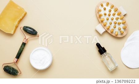 Natural beauty care set featuring marble facial roller, gua sha, wooden body brush, cream and serum Natural beauty care set featuring marble facial roller, gua sha, wooden body brush, cream and serum 136709222