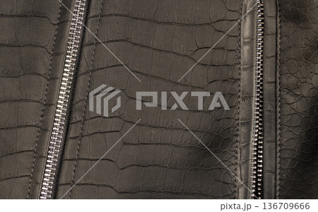 black artificial fabric in the style of crocodile skin with specks and spots , close up black artificial fabric in the style of crocodile skin with specks and spots , close up 136709666