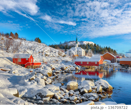 Outstanding winter scenery of Moskenes village with ferryport and famous Moskenes parish Church. 136709722