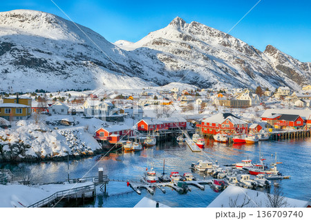 Captivating snowy  cityscape of Sorvagen town and port. 136709740