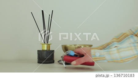 Woman puts house keys on shelf in hallway. Moving, real estate concept. Rental, realty concept. Woman puts house keys on shelf in hallway. Moving, real estate concept. Rental, realty concept. 136710183