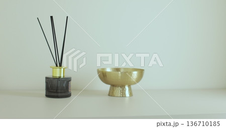 Woman puts her car keys on a shelf in the hallway. Woman puts her car keys on a shelf in the hallway. 136710185