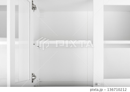White cupboard with open door 136710212