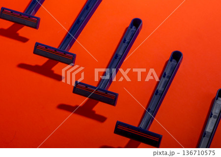 Shaving razors on a colored background Shaving razors on a colored background 136710575