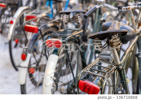 Urban bicycle parking covered with winter snow 136710808