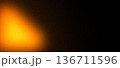 Fiery orange yellow glow noise gradient background with dark blur 136711596