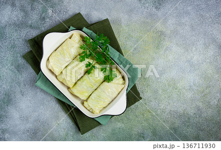raw cabbage rolls, not cooked, with minced meat, top view, without people, in the spotlight. 136711930