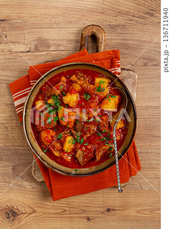 Potatoes with meat, stewed in tomato sauce, with spices and herbs, homemade, no people, 136711940