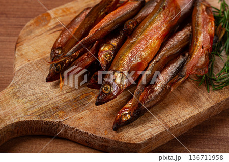 cold smoked capelin, on a wooden chopping board, no people, cold smoked capelin, on a wooden chopping board, no people, 136711958