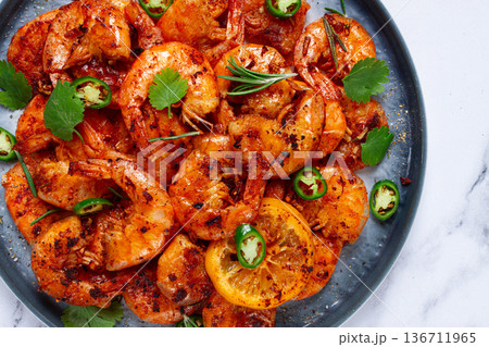 grilled shrimp, unpeeled, headless, with spices, on a marble table, homemade, no people, 136711965