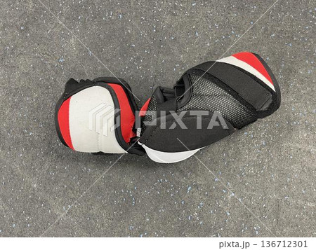 hockey arm guard on the gray background hockey arm guard on the gray background 136712301