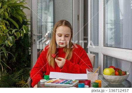 young girl eating red strawberry and sitting young girl eating red strawberry and sitting 136712457