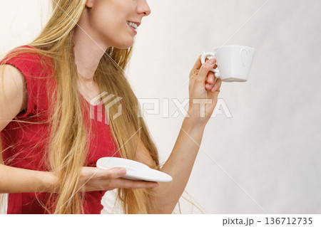 Blonde girl with coffee cup 136712735