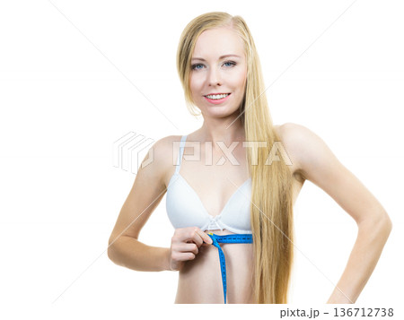 Woman measuring her chest under breasts Woman measuring her chest under breasts 136712738