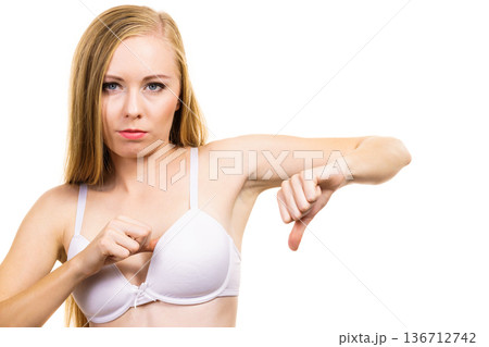 Woman dissatisfied with size of bra breasts 136712742