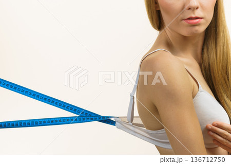 Woman wearing too big bra, loose band Woman wearing too big bra, loose band 136712750