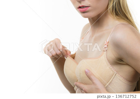 Woman wearing too big bra Woman wearing too big bra 136712752