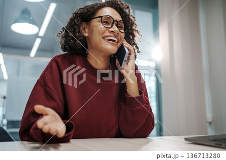 Smiling Woman In Modern Office Actively Communicating With Client Using Expressive Gestures Smiling Woman In Modern Office Actively Communicating With Client Using Expressive Gestures 136713280