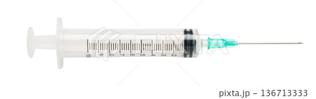 medical syringe close-up on a white isolated medical syringe close-up on a white isolated 136713333