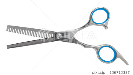 Hairdressing scissors close-up on a white isolated Hairdressing scissors close-up on a white isolated 136713387