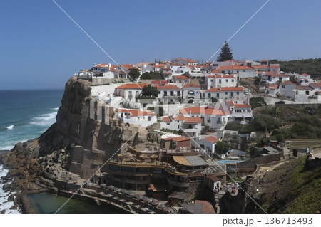 Traditional white village of Azenhas do Mar perched on a cliff, Portugal. 136713493