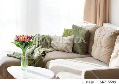 Living Room Decorated Spring Tulip Bouquet in Green Vase. Cozy Home Decor Arrangement 136713599