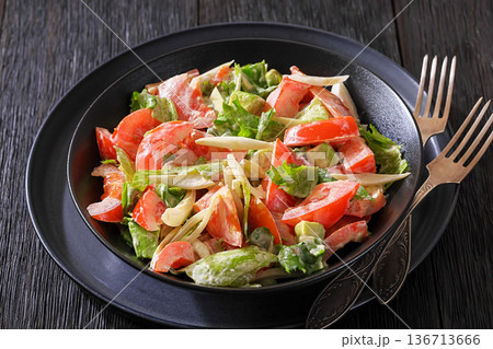 Avocado tomato salad with lettuce and mayonnaise Avocado tomato salad with lettuce and mayonnaise 136713666