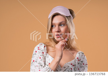 Charming Woman Doing Face Massage With Rose Quartz Stone Roller For Firmer Charming Woman Doing Face Massage With Rose Quartz Stone Roller For Firmer 136713768