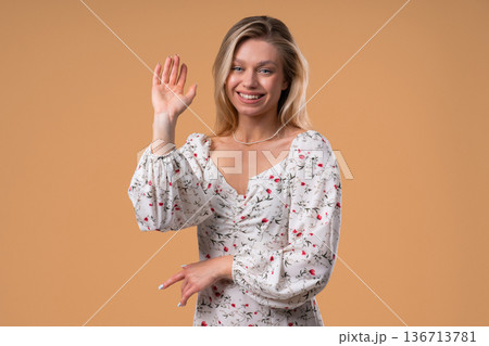 Friendly Young Blonde American Woman Waving Hand - Hello, Or Salute, Chao Friendly Young Blonde American Woman Waving Hand - Hello, Or Salute, Chao 136713781