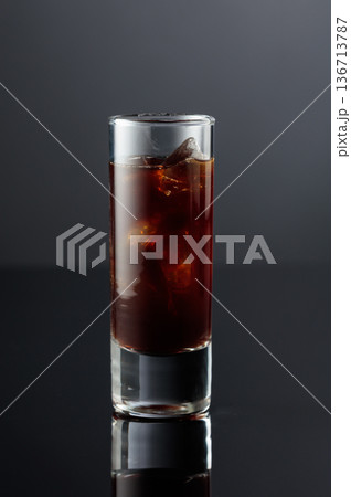 Coffee liquor with ice in tall glass. 136713787