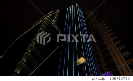 Illumination of modern skyscrapers illuminated urban architecture at night, cityscape 136713799
