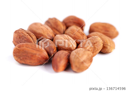 Hazelnuts kernels on a white background, healthy food. Macro Hazelnuts kernels on a white background, healthy food. Macro 136714596