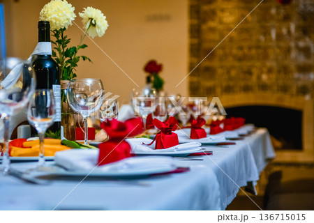 Festive table setting with bread and wine glasses Festive table setting with bread and wine glasses 136715015