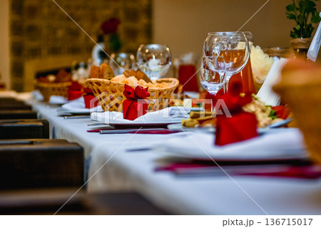 Festive table setting with bread and wine glasses Festive table setting with bread and wine glasses 136715017