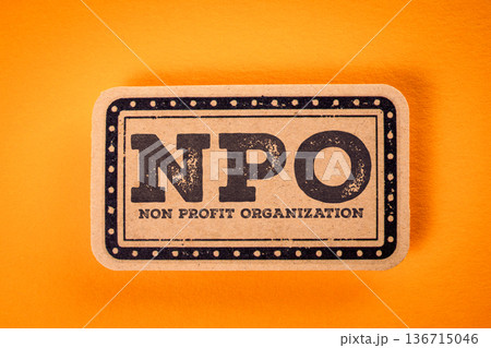 NPO Non Profit Organization Concept With Vintage Business Label On Orange Background 136715046