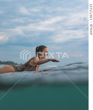 Eager Young Lady Balancing On Surfboard During Sunrise Peaceful Ocean Eager Young Lady Balancing On Surfboard During Sunrise Peaceful Ocean 136715225