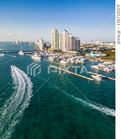 Miami marina with yachts and sailboats. Miami marina and turquoise ocean. Miami seascape aerial view on south beach shore. 136718924