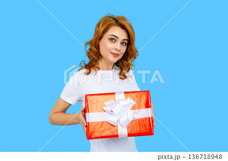 Holidays and celebration. Women with gift concept. Portrait of woman hold gift box. Girl celebrating birthday and receive presents. Girl celebrate 8-march, 14-february day, womans day, mothers day. Holidays and celebration. Women with gift concept. Portrait of woman hold gift box. Girl celebrating birthday and receive presents. Girl celebrate 8-march, 14-february day, womans day, mothers day. 136718948