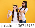 Daughter is a princess for mother. A queen and her little princess. Fairy tales family. Crowns and magic. Mothers day. Princess dreams. Girls party. Fairy crown. Little fairy. Queen and princess. 136718952