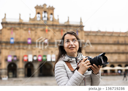 Woman with camera on Plaza Mayor, Salamanca Woman with camera on Plaza Mayor, Salamanca 136719286