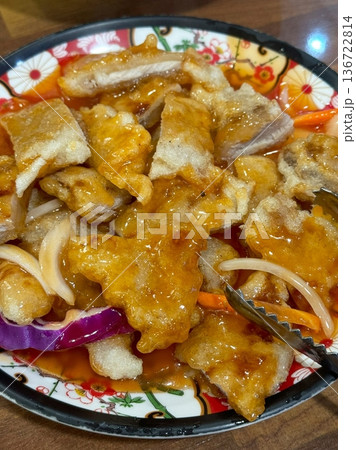 Guobaorou, a classic Chinese dish of crispy pork strips coated in a sweet and tangy sauce. Balanced flavors and crunch make it an irresistible comfort food choice. Guobaorou, a classic Chinese dish of crispy pork strips coated in a sweet and tangy sauce. Balanced flavors and crunch make it an irresistible comfort food choice. 136722814