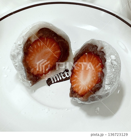 Mochi is a Japanese cake made from glutinous rice, pounded until it is soft and sticky, then shaped into a round shape. Various colors of mochi cake, traditional Japanese food 136723129