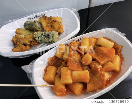 Spicy and chewy tteokbokki paired with rich and savory sundae, creating a classic Korean street food combination. A perfect balance of bold flavors and satisfying textures for an indulgent treat. 136726959