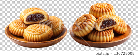 Traditional Maamoul cookies, one halved showing date and nut filling, isolated on white background, concept of Arabic desserts Traditional Maamoul cookies, one halved showing date and nut filling, isolated on white background, concept of Arabic desserts 136729009