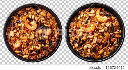 Stir-fried shrimp Pad Thai with crushed peanuts and rice noodles, isolated on white background, concept of Thai cuisine 136729012