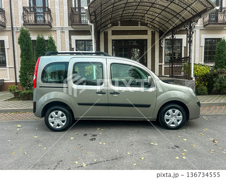 Vehicle parked in front of building with outdoor structure, trees nearby, during daytime, showing details of spot and surroundings Vehicle parked in front of building with outdoor structure, trees nearby, during daytime, showing details of spot and surroundings 136734555