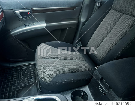 Car interior showing a driver seat with fabric design, located in a modern vehicle, taken during daylight Car interior showing a driver seat with fabric design, located in a modern vehicle, taken during daylight 136734590