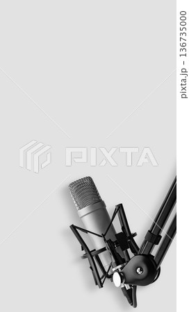 Podcast recording setup with microphone on boom arm Podcast recording setup with microphone on boom arm 136735000
