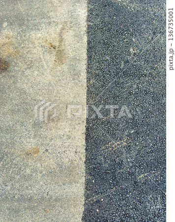 Concrete and gravel surface meeting line at a construction site in daytime under natural light showing different textures and colors Concrete and gravel surface meeting line at a construction site in daytime under natural light showing different textures and colors 136735001